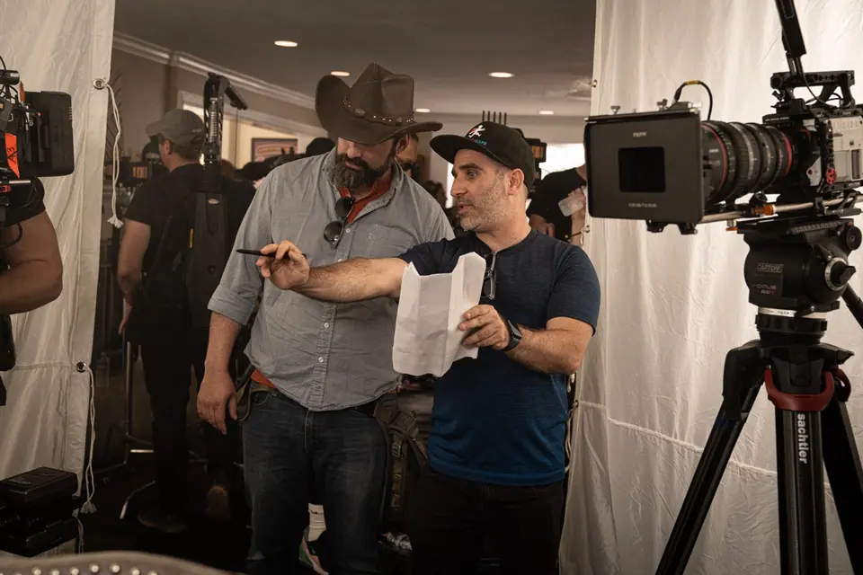 Ben Giroux directing beside the cinema camera on the Bar-S Guy set