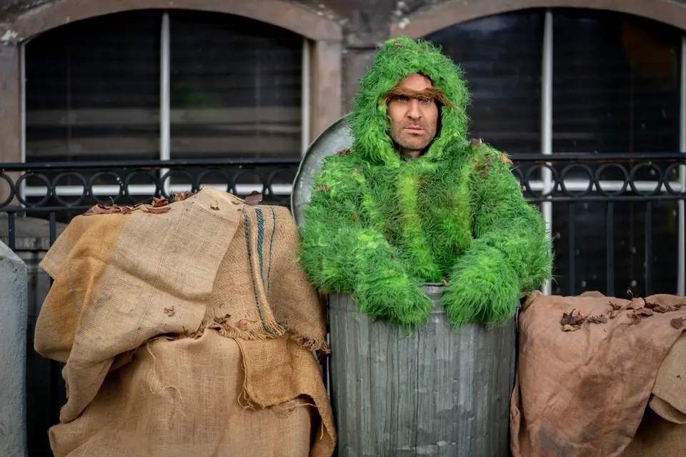 Ben Giroux performing as a practical trash-can character on Back to the 80s