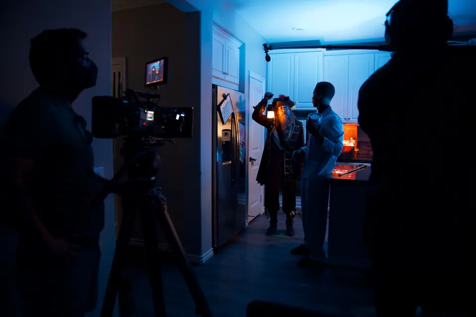 Cinema camera and lighting crew filming the Geico Kitchen Island cast