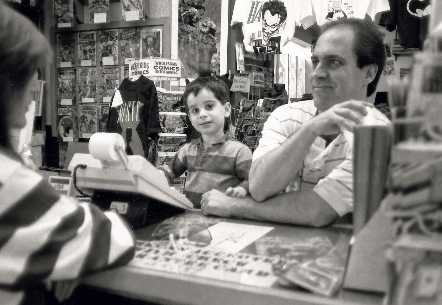 Ben Giroux as a little boy working alongside his dad in the family comic-book store